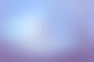 A Blurry Purple And Blue Background Wallpaper