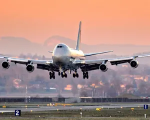 'a Boeing 747 Airplane Taking Off Against A Blue Sky' Wallpaper