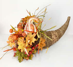 A Bountiful Fall Cornucopia Overflowing With Fruits, Vegetables, And Flowers. Wallpaper
