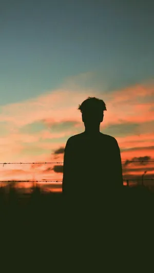 A Boy Shadow Watching The Sunset Wallpaper
