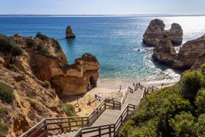 A Breathtaking View Of Portuguese Beach At Sunset Wallpaper