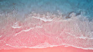 A Breathtaking View Of The Stunning Pink Sand Beach Wallpaper