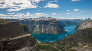 A Breathtaking View Of Trolltunga On A Sunny Day Wallpaper