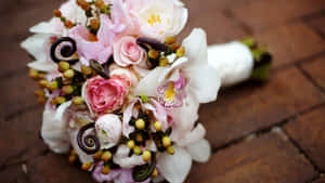 A Bride Holding A Beautiful Wedding Bouquet Wallpaper