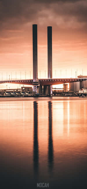 A Bridge With Two Towers In The Background Wallpaper