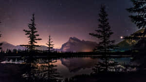 A Bright Star Shining In The Night Sky Wallpaper