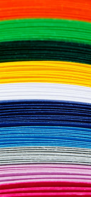 A Brilliant Yellow Sun Over A Cityscape During Dawn Wallpaper