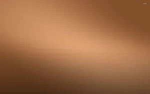 A Brown Background With A Light Brown Color Wallpaper