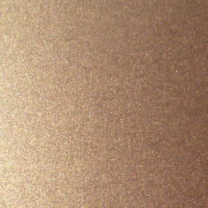 A Brown Laptop On A Table Wallpaper