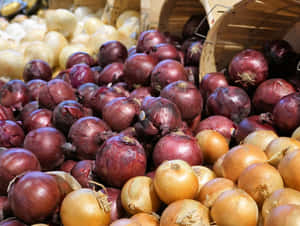 A Bunch Of Freshly Picked Purple Onions Wallpaper