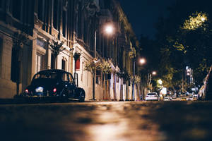 A Busy Night Street In The Heart Of The City. Wallpaper