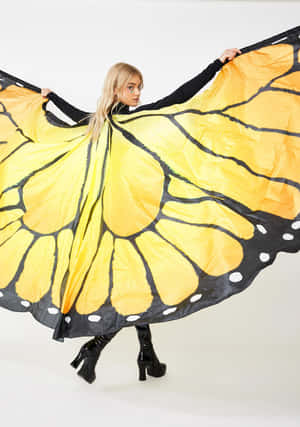 A Butterfly Wing Dress For A Storybook Celebration Wallpaper