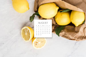 A Calendar With Lemons On It Wallpaper