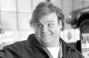 A Captivating Portrait Of Chris Farley Wallpaper