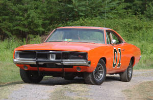 A Car On A Dirt Road Wallpaper