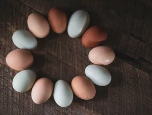 A Carton Of Brown Eggs On A Rustic Table Wallpaper