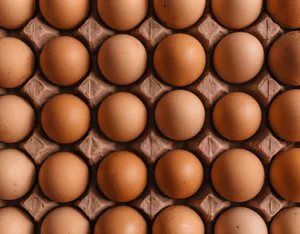A Carton Of Fresh Brown Eggs On A Rustic Wooden Table Wallpaper