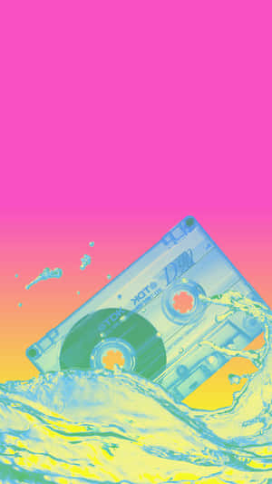 A Cassette Tape In The Water With A Pink Background Wallpaper