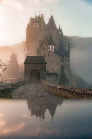 A Castle Is Reflected In The Water Wallpaper