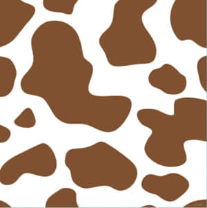 A Charming Brown Cow Grazing Peacefully On A Sunny Day Wallpaper