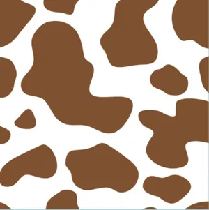 A Charming Brown Cow Grazing Peacefully On A Sunny Day Wallpaper