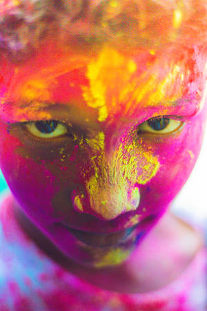 A Child Celebrating Happy Holi Hd Wallpaper