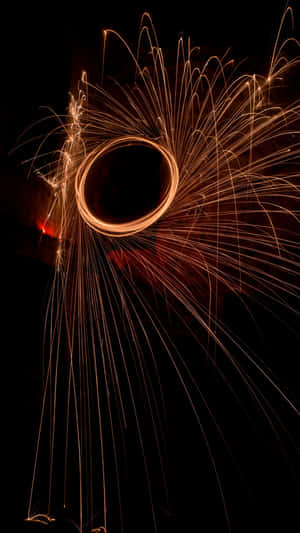 A Circle Of Sparks In The Dark Wallpaper