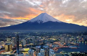 A City And Mountain At Dusk Wallpaper