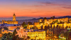 A City At Dusk With A Castle And Trees Wallpaper