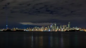 A City Skyline With A City In The Background Wallpaper