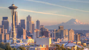 A City Skyline With A Mountain In The Background Wallpaper