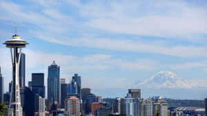 A City With A Mountain In The Background Wallpaper