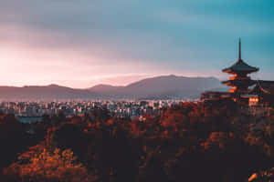 A City With A Pagoda In The Background Wallpaper