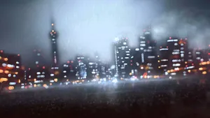 A Cityscape With Lights And Buildings In The Rain Wallpaper