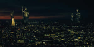 A Cityscape With Statues On Top Of It Wallpaper