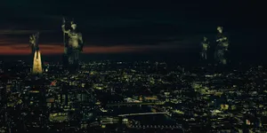 A Cityscape With Statues On Top Of It Wallpaper