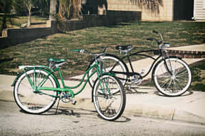 A Classic Beach Cruiser Bicycle Parked On The Shore With The Bright Ocean Waves In The Background Wallpaper