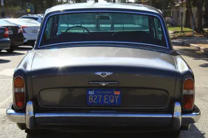 A Classic Bentley T1 Automobile In A Parking Lot Wallpaper