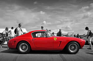 A Classic Ferrari Lit Up In Yellow Lights. Wallpaper