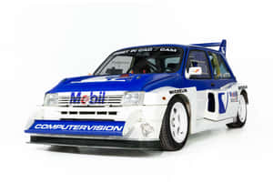 A Classic Mg Metro 6r4 In Intense Racing Action Wallpaper
