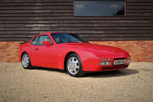 A Classic Porsche 944 Looking Radiant And Regal In Red Wallpaper