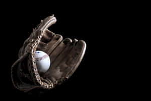 A Close-up Look Of A Baseball Glove Collection Wallpaper