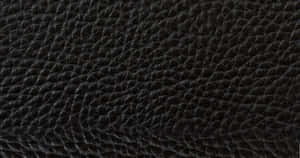 A Close Up Of A Black Leather Surface Wallpaper