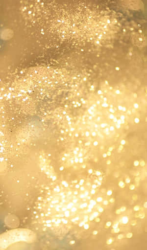 A Close Up Of A Gold Glitter Background Wallpaper