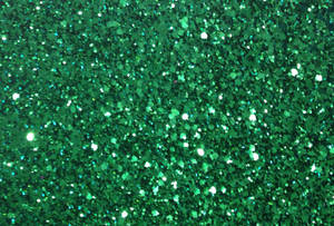 A Close Up Of A Green Glitter Wallpaper