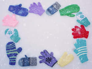 A Close-up Of A Pair Of Cozy, Knitted Mittens Against A Rustic Wooden Background. Wallpaper