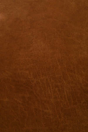 A Close-up Of A Rich Brown Leather Texture Wallpaper