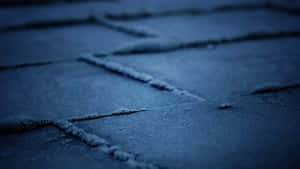 A Close Up Of A Tiled Floor At Night Wallpaper