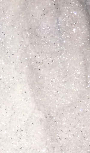 A Close Up Of A White And Silver Glitter Wallpaper