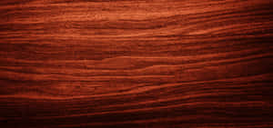 A Close-up Of Mahogany Wood Grain Texture Wallpaper